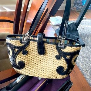 Brighton woven/ wicker purse with black leather look handles / trim.